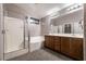 Main bath with double sink, tub and shower combo, and tile flooring at 9712 Red Horse St, Las Vegas, NV 89143
