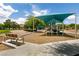 Community playground with bench seating, slides, and sun shade at 9712 Red Horse St, Las Vegas, NV 89143