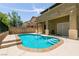 Private backyard pool has steps for entry, perfect for relaxation and entertaining at 9712 Red Horse St, Las Vegas, NV 89143