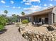 Beautiful backyard features a patio area, rock landscaping, and plenty of space for outdoor enjoyment at 10417 Sea Palms Ave, Las Vegas, NV 89134