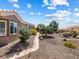 The property showcases a stone path winding through desert landscaping, leading to an inviting outdoor space at 10417 Sea Palms Ave, Las Vegas, NV 89134