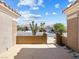 Inviting courtyard featuring a brick wall, desert landscaping, and neighborhood views at 10417 Sea Palms Ave, Las Vegas, NV 89134