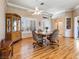 Dining area featuring hardwood floors, a ceiling fan, and natural light at 10417 Sea Palms Ave, Las Vegas, NV 89134