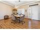 Dining area featuring hardwood floors, a ceiling fan, and natural light at 10417 Sea Palms Ave, Las Vegas, NV 89134