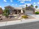 Charming single-story home showcasing desert landscaping and a two-car garage at 10417 Sea Palms Ave, Las Vegas, NV 89134
