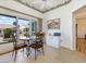 Eat-in kitchen featuring sliding door access to the outdoor patio and extra cabinet space at 10417 Sea Palms Ave, Las Vegas, NV 89134