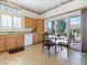 Eat-in kitchen featuring granite counters, cabinets, and sliding door access to the outdoor patio and seating at 10417 Sea Palms Ave, Las Vegas, NV 89134