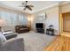 Cozy living room with carpeted floors, neutral colors, and bright, shuttered windows at 10417 Sea Palms Ave, Las Vegas, NV 89134