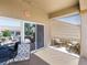 Comfortable covered patio features neutral tones, stone accents and access to the backyard at 10417 Sea Palms Ave, Las Vegas, NV 89134