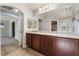 Bathroom featuring a double sink vanity with dark wood cabinets and tile flooring at 10917 Mount Pendleton St, Las Vegas, NV 89179