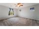 Spacious bedroom featuring a ceiling fan and ample natural light at 10917 Mount Pendleton St, Las Vegas, NV 89179