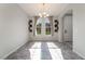 Bright dining room featuring large windows and a modern chandelier at 10917 Mount Pendleton St, Las Vegas, NV 89179