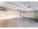 Clean, spacious three car garage with ample lighting and finished concrete floor at 10917 Mount Pendleton St, Las Vegas, NV 89179