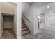 Hallway featuring tile floors, carpeted stairs and modern design at 10917 Mount Pendleton St, Las Vegas, NV 89179
