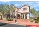 Charming two-story home exterior with manicured landscaping, inviting curb appeal, and brick accents at 10917 Mount Pendleton St, Las Vegas, NV 89179