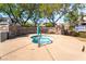 Relaxing hot tub with stone accents, nestled among mature landscaping and residential buildings at 10917 Mount Pendleton St, Las Vegas, NV 89179