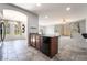 Open concept kitchen area with sleek appliances and tile flooring at 10917 Mount Pendleton St, Las Vegas, NV 89179