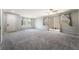 Bright living room boasts recessed lighting, gray carpet, and easy access to the backyard at 10917 Mount Pendleton St, Las Vegas, NV 89179