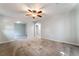 Bright living room featuring neutral tones, a ceiling fan, and an open doorway to another room at 10917 Mount Pendleton St, Las Vegas, NV 89179