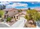 Beautiful home offers a spacious driveway and desert-friendly landscaping at 11091 Parete Ct, Las Vegas, NV 89141