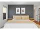 Bedroom features hardwood floors, neutral decor, and a view from the window at 11091 Parete Ct, Las Vegas, NV 89141