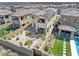 A bird's eye view of a beautiful backyard with patio, fireplace and green lawn at 11652 Desert Hollow Ave, Las Vegas, NV 89138