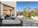 Backyard features a patio with seating, a fire pit and beautiful mountain views at 11652 Desert Hollow Ave, Las Vegas, NV 89138
