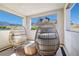 Cozy outdoor balcony seating area with fantastic mountain views at 11652 Desert Hollow Ave, Las Vegas, NV 89138