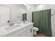 Stylish bathroom with dual sinks, white countertops, and modern fixtures at 11652 Desert Hollow Ave, Las Vegas, NV 89138