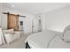 Bright primary bedroom with a barn door leading to ensuite bath at 11652 Desert Hollow Ave, Las Vegas, NV 89138