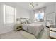 Charming bedroom with neutral tones, stylish decor, and ample natural light at 11652 Desert Hollow Ave, Las Vegas, NV 89138