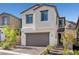Charming two-story home showcasing a neutral exterior and a convenient two-car garage at 11652 Desert Hollow Ave, Las Vegas, NV 89138