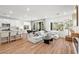 Bright, open-concept living area featuring hardwood floors and modern décor at 11652 Desert Hollow Ave, Las Vegas, NV 89138