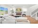 Cozy living room with fireplace, modern decor, and lots of natural light at 11652 Desert Hollow Ave, Las Vegas, NV 89138