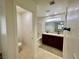 Bathroom features dual sinks, dark wood cabinets, and a separate toilet and tub/shower at 11953 Haven St, Las Vegas, NV 89183