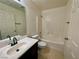 Standard bathroom with a tub, toilet, vanity, and tiled floor at 11953 Haven St, Las Vegas, NV 89183