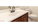 Bathroom featuring a vanity with dark cabinets and a white countertop with matching toilet at 11953 Haven St, Las Vegas, NV 89183