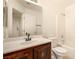 Bathroom features a vanity with a sink, toilet, and a shower over tub at 11953 Haven St, Las Vegas, NV 89183