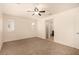 Bedroom with neutral colored walls and carpets and multiple windows with plantation shutters at 11953 Haven St, Las Vegas, NV 89183
