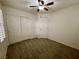 Bedroom with neutral carpet, ceiling fan, and a closet at 11953 Haven St, Las Vegas, NV 89183