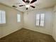 Bedroom with neutral carpet, ceiling fan, plantation shutters, and a closet at 11953 Haven St, Las Vegas, NV 89183