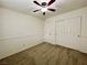Bedroom with neutral carpet and paint, a ceiling fan, and a closet with sliding doors at 11953 Haven St, Las Vegas, NV 89183