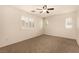 Light and bright bedroom with carpeted floors and plantation shutters on the windows at 11953 Haven St, Las Vegas, NV 89183