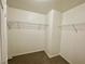 Walk-in closet features neutral carpet and wire shelving at 11953 Haven St, Las Vegas, NV 89183
