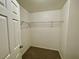 Walk-in closet features neutral carpet and wire shelving at 11953 Haven St, Las Vegas, NV 89183