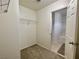 Walk-in closet leads to the bathroom and features neutral carpet and wire shelving at 11953 Haven St, Las Vegas, NV 89183
