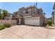 Two-story home featuring a neutral stucco exterior, white trim, and an attached two-car garage at 11953 Haven St, Las Vegas, NV 89183