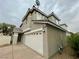 Two-story home with a two-car garage, neutral stucco, and a well-manicured front yard at 11953 Haven St, Las Vegas, NV 89183