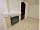 Cozy fireplace and built-in shelving offer a relaxing ambiance to the living space at 11953 Haven St, Las Vegas, NV 89183