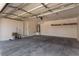 Spacious two-car garage with concrete flooring, water heater, and side access door at 11953 Haven St, Las Vegas, NV 89183